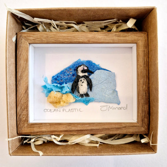 Framed Wall Art made from upcycled ocean plastic pollution by Janet Ormond penguin