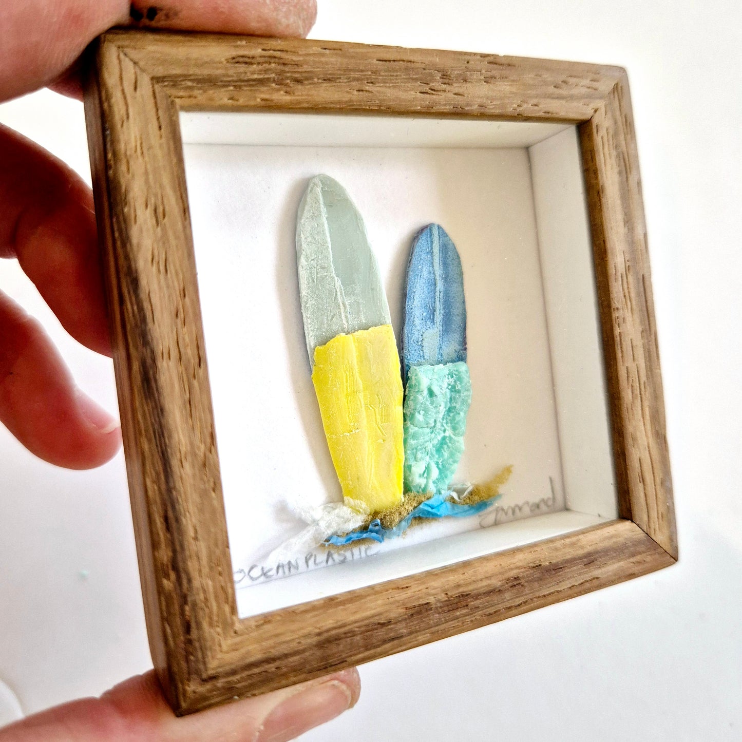 Framed Wall Art made from upcycled ocean plastic pollution by Janet Ormond Surfboard art